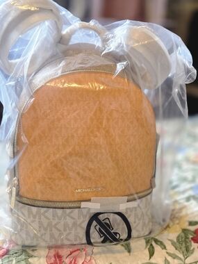 Michael Kors Orange and Cream Logo Dome Mini Backpack